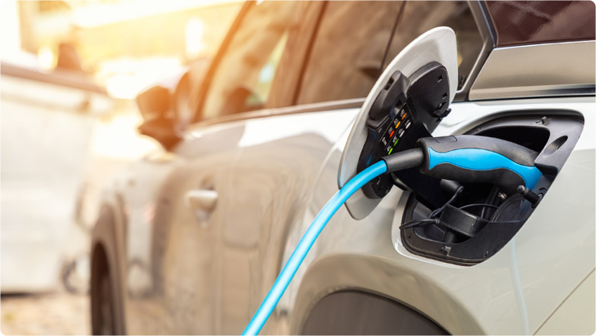 Electric car plugged into charger